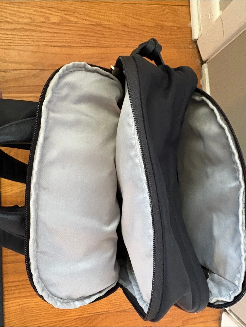 Tumi Voyageur Celina Black Backpack with Gold Hardware and Multiple Zip Pockets
